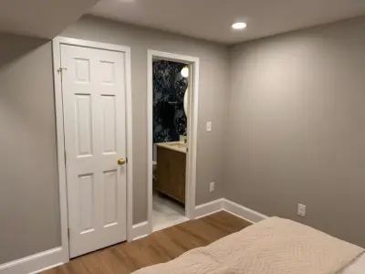 Mt Ida Completed Basement with Bathroom, Laundry Room, Bedroom, and Recreation Area — Home Renovation & Remodeling Services project by Beverly Thomas LLC