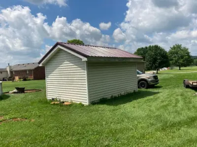 Installation of a new metal roof on the outbuilding — Home Renovation & Remodeling Services project by Central Kentucky Contractors