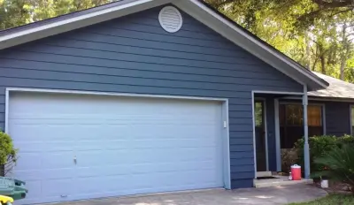 Updated Exterior: Siding, Painting, and Window Installation — Home Renovation & Remodeling Services project by Miller Construction Group, LLC