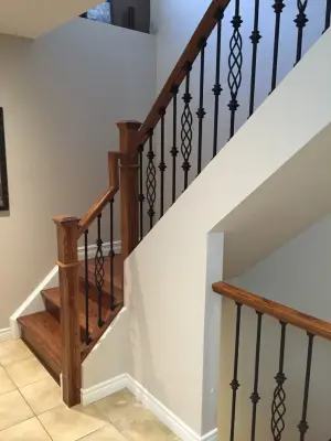 Updated staircase with handrail and wrought iron balusters — Home Renovation & Remodeling Services project by Buildby7 LLC