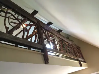 Rustic Wood Railing with Sculpted Birds — Home Renovation & Remodeling Services project by Mountain Laurel Handrail