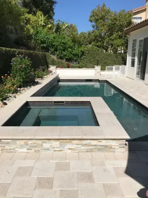 Thousand Oaks outdoor living space with pool tile, pavers, fireplace, BBQ, and kitchen — Kitchen Remodeling project by Hue Of You Decor, LLC
