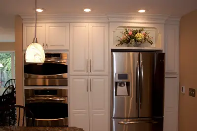 Contrasting Island in a White Kitchen — Kitchen Remodeling project by Kitchens & Interiors, Inc.