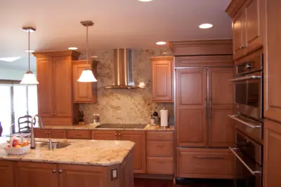 Ceiling-Height Granite Backsplash Kitchen — Kitchen Remodeling project by Kitchens & Interiors, Inc.