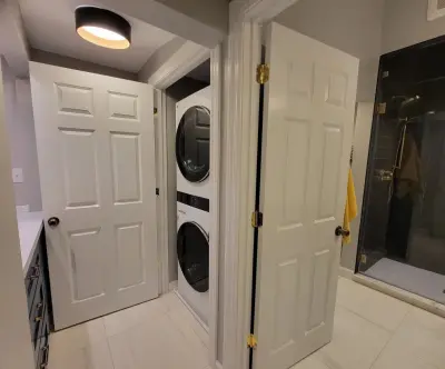 Laundry Space Adjacent to Master Bathroom — Kitchen Remodeling project by Paula Anane - Perspective Cabinetry And Design
