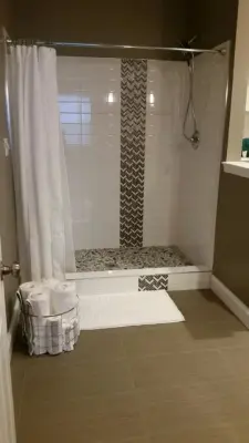 Transforming a Concrete Basement into a Stunning Full Bathroom — Kitchen Remodeling project by Stacey Kocevar Designs, LLC
