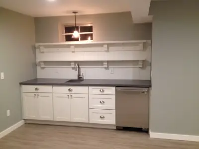 Basement remodel featuring a kitchen and barn door — Kitchen Remodeling project by Kaja Gam Design, Inc. & KGHome