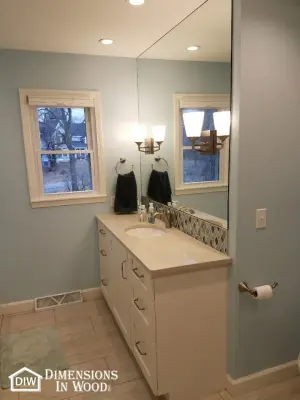 Glass-Enclosed Shower Bathroom Renovation with Taj Mahal Vanity and Custom Cabinetry — Kitchen Remodeling project by Dimensions In Wood Inc