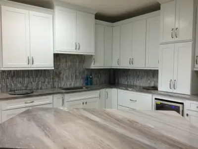 Custom Shaker Cabinetry with Blue Marble Countertops — Kitchen Remodeling project by Emerald Coast Fabrication