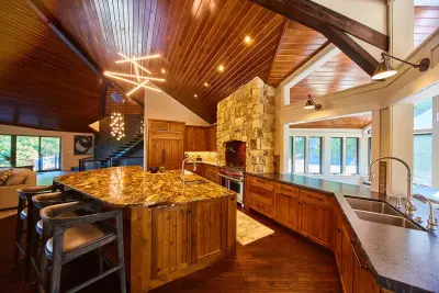 Brown Marinace Textured Island with Black Pearl Leathered Finish — Kitchen Remodeling project by Classic Marble & Stone