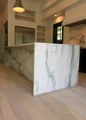 Modern Kitchen Design Featuring a Marble Waterfall Countertop — Kitchen Remodeling project by Classic Cupboards, Inc