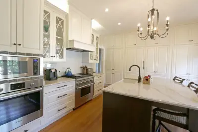 Curved Island Countertop Offers Workspace and Dining Area — Kitchen Remodeling project by Classic Cupboards, Inc