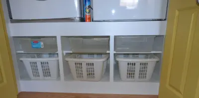 Bespoke laundry storage space — Kitchen Remodeling project by Remodeling And Painting Experts Inc.