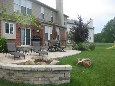 Patio with Boulder Fire Pit — Design-Build Services project by Surroundings By Natureworks