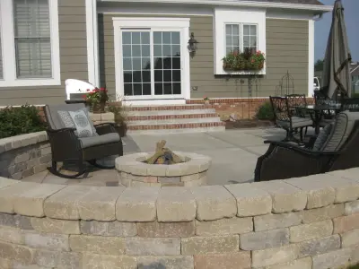 Beautiful Patio with Stone Wall and Fire Element — Design-Build Services project by Surroundings By Natureworks