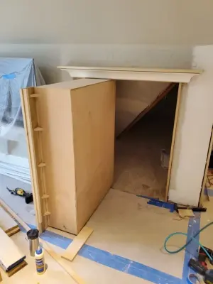 Concealed Storage Bookshelf by Multi Drywall & Partition, LLC