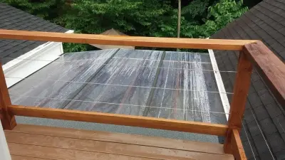 Clintonville screened patio featuring custom mahogany bifold doors and rough-sawn cedar — Carpentry & Woodworking project by Norwegian Wood