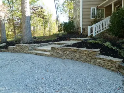 Creative Stone Patio by Wildwood Land Design