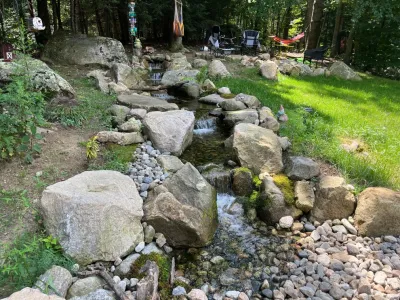 Front Yard 32’ Pondless Waterfall — Landscape Design project by NATURAL ELEMENTS By Design in Richmond