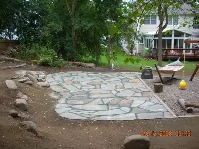Natural Stone Patio in Field and Blue Variations by Arborcare Landscape Services & Products, LLC.