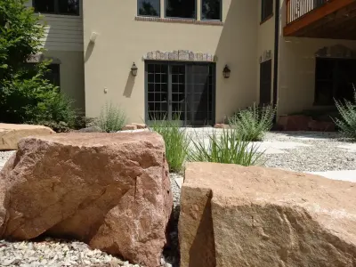 Serene escape featuring a gravel patio and cascading waterfalls — Landscape Design project by Landscape Solutions By Susan Murphy, LLC