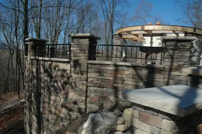 Pittsburgh Region Deck, Stone Patio, Fireplace, Pergola, and Landscaping by Karl Steinmetz Landscape Architect