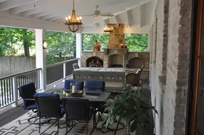Enclosed Composite Deck with Elegant Outdoor Fireplace by Covenant Pool And Landscape