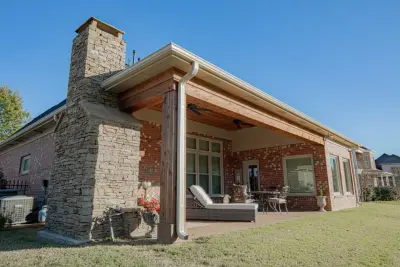 Enclosed Porch and Outdoor Fireplace in Lakeland, TN by Covenant Pool And Landscape