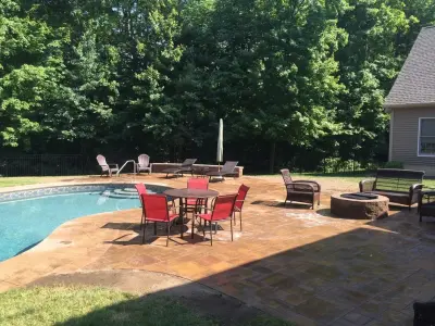 Patio Pool Deck with Seating Wall and Fire Pit — Landscape Design project by Arborcare Landscape Services & Products, LLC.