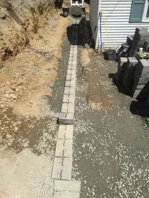 Substitution of Layered Segmented Concrete Block Retaining Wall — Landscape Design project by Arborcare Landscape Services & Products, LLC.