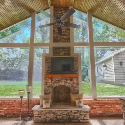 Enclosed Porch with Fireplace and Outdoor Cooking Area — Landscape Design project by Covenant Pool And Landscape
