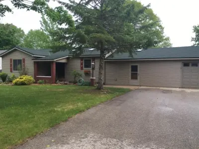 Metal Shingles with Stone Coating — Roofing & Gutter Services project by Green Horizons Metal Roofing