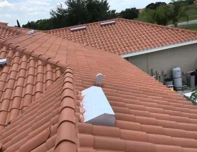 Clay Roof Tile Replacement — Roofing & Gutter Services project by Kingdom Roofing Inc.