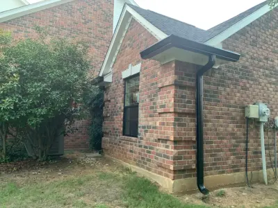 Elegant black gutters fitted on a residence in Keller — Roofing & Gutter Services project by Sharp Seamless Gutter