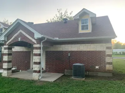 Renovated house featuring new gutters — Roofing & Gutter Services project by Sharp Seamless Gutter