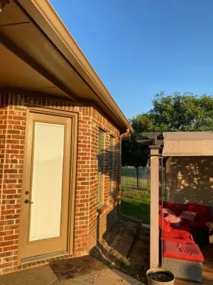 Elegant spacious residence with 6-inch Buckskin Brown gutters installed — Roofing & Gutter Services project by Sharp Seamless Gutter