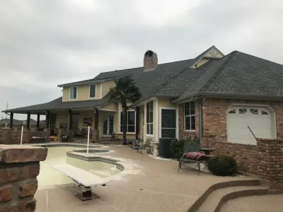 Elegant 6-inch dove gray gutters with 3x4 downspouts — Roofing & Gutter Services project by Sharp Seamless Gutter