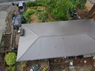 Weathered Copper Metal Roofing — Roofing & Gutter Services project by Orca Roofing & Exteriors