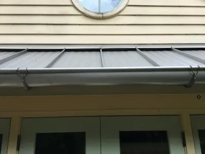 Zinc semi-circular gutters — Roofing & Gutter Services project by Royal Gutters, Inc.