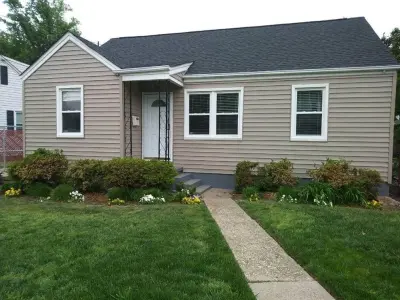 Encore Natural Clay Siding by CertainTeed and GAF Timberline HD Shingles in Charcoal — Roofing & Gutter Services project by WT Anderson Corp.