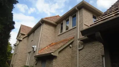 Cedar Shake Roof Integrated with Low-Slope TPO Roofing System — Roofing & Gutter Services project by Swistun, Inc
