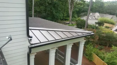 Highland Slate by CertainTeed with Standing Seam Metal Roofing — Roofing & Gutter Services project by Roof Authority
