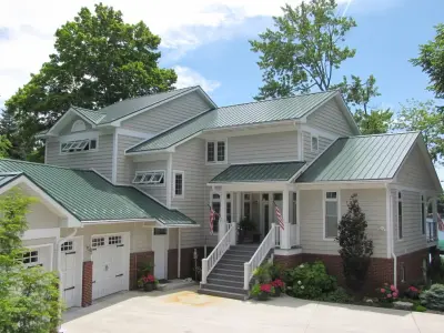 Traditional Green Vertical Seam Metal Roofing — Roofing & Gutter Services project by Coated Metals Group