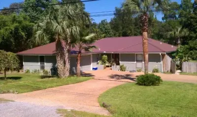 Cocoa Brown Screw-Down Roofing 2011 — Roofing & Gutter Services project by Coastal Metal Roofing, Inc.