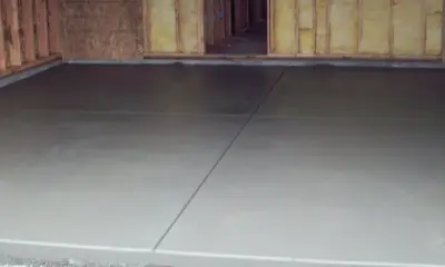 Garage Flooring and Blacktop Driveway — Roofing & Gutter Services project by NHL Roofing & Construction