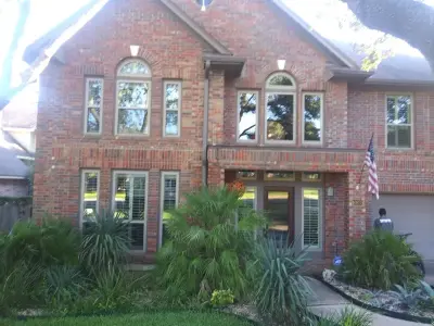 Red Brick House Gutter Installation in Kingsland, TX 78639 — Roofing & Gutter Services project by Gutter Tex