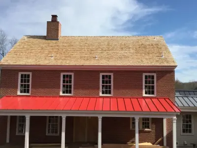 Updated Red Metal Roof for Middle Creek — Roofing & Gutter Services project by Middle Creek Roofing