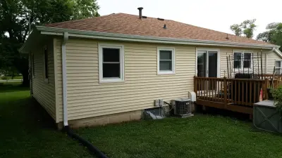 Updated siding and windows — Roofing & Gutter Services project by Midwest Construction & Supply INC