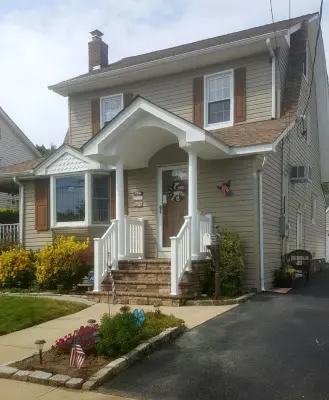 Portico — Roofing & Gutter Services project by American Dream Home Improvement, Inc.
