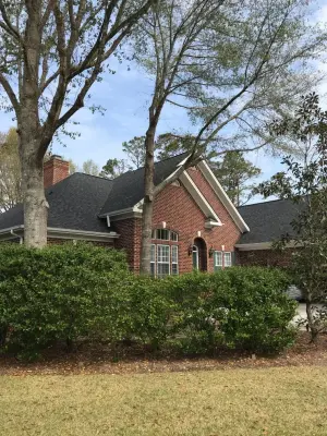 Crimson Brick Residence — Roofing & Gutter Services project by Patriot Roofing Company